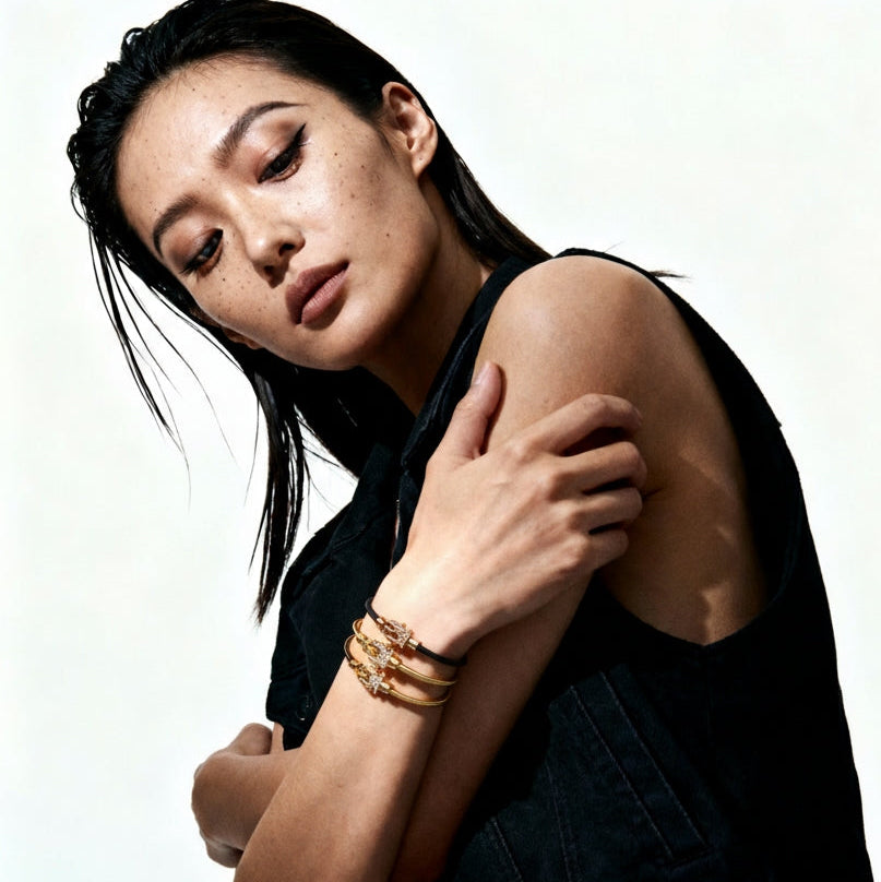 Three Diapason VIBES bracelets worn with a black outfit